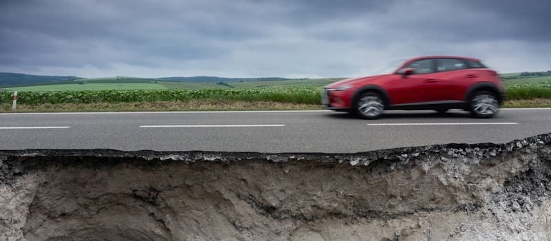 Car traveling on earthquake damaged highway