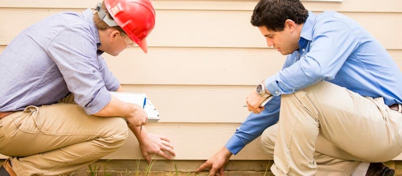 Home inspectors checking a foundation