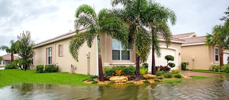 Home surrounded by flood waters