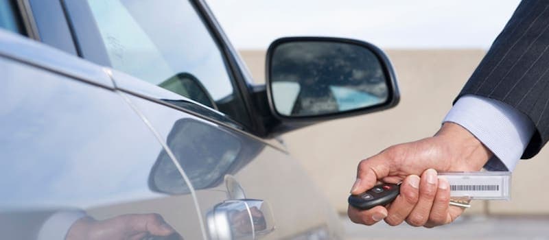 Man unlocking rental car