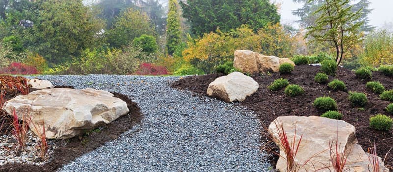 Gravel path through a landscaped area