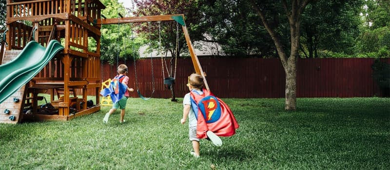Two kids playing in the backyard