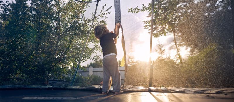 Child closing trampoline safety net